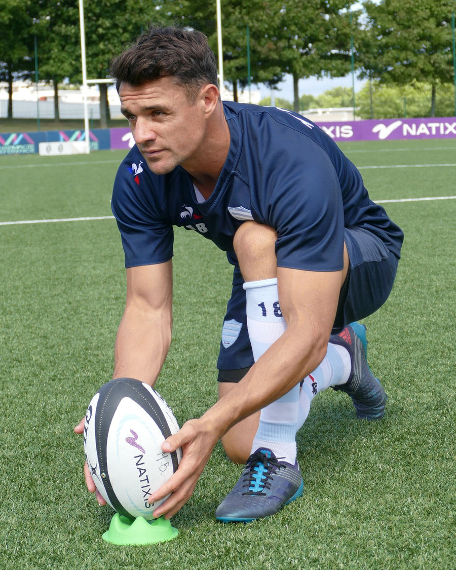 Dan Carter setting the ball on a Supertee